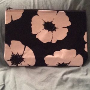 Black zipper pouch w/ white flowers.